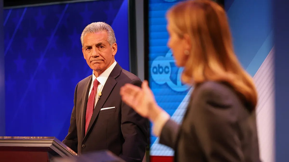 Republican Jack Ciattarelli looks at Democrat Mikie Sherrill during the debate