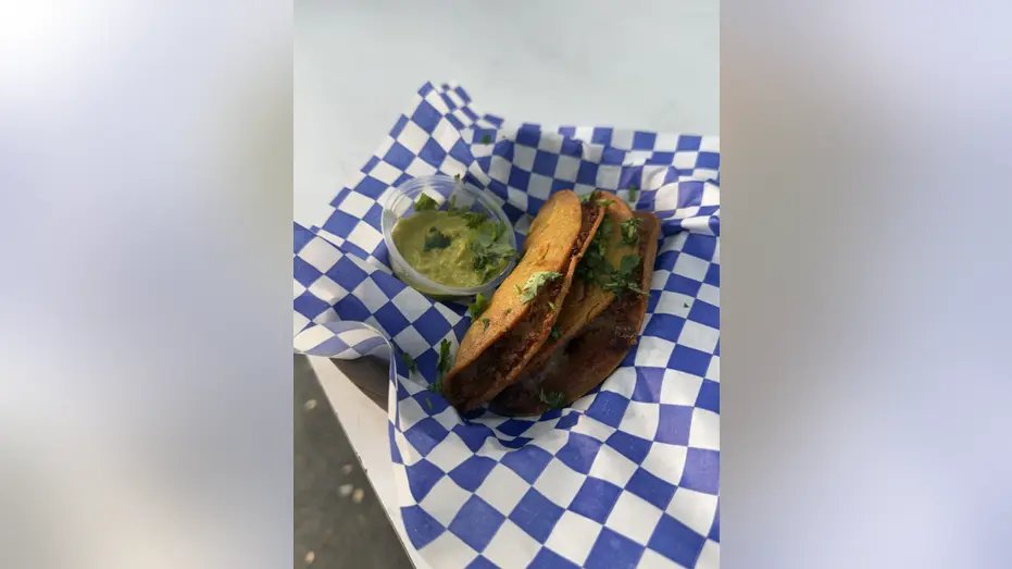 Fried tacos in a basket.