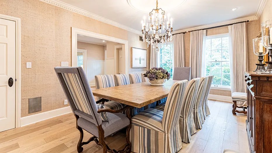 The dining room has a table with enough space for eight people.