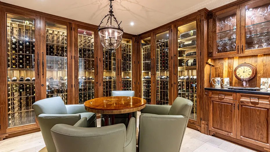 The wine tasting room has a table and chairs in the center.