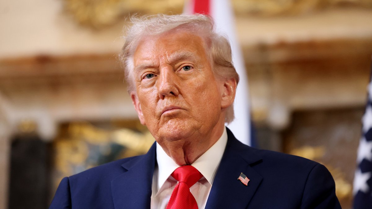 Trump listens during a news event in the United Kingdom 