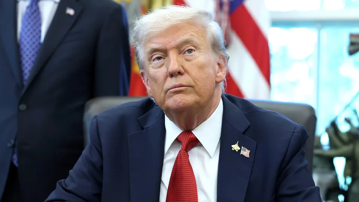 Donald Trump answers questions in the Oval Office