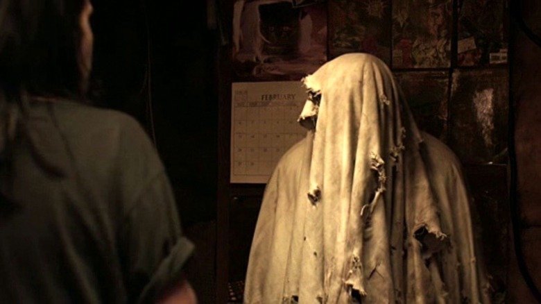A ghost covered in a blanket in Housebound