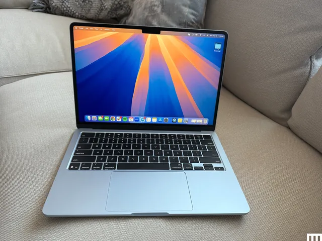 Front view of an open MacBook Air 13 -inch Apple MacBook Air sofa with the screen that displays the desktop surface