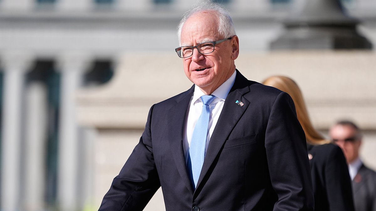 Governor Tim Walz walks near the Minnesota State Capitol