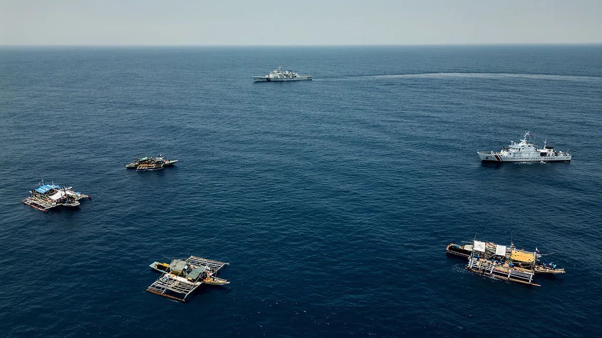 Chinese Coast Guard and Philippine fishing boats
