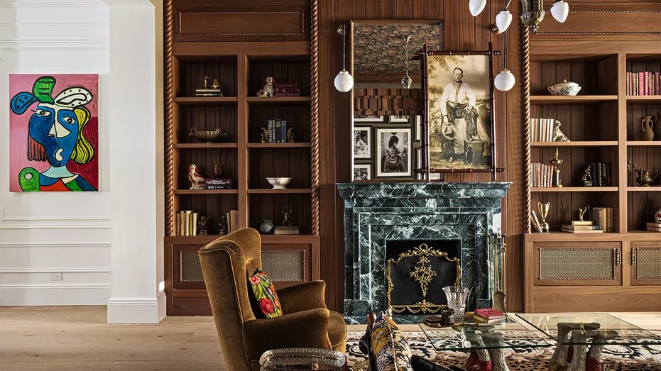 The home also has a secondary living room with a fireplace and built-in shelves.