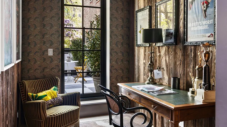 The house also has a home office with unique wallpaper.