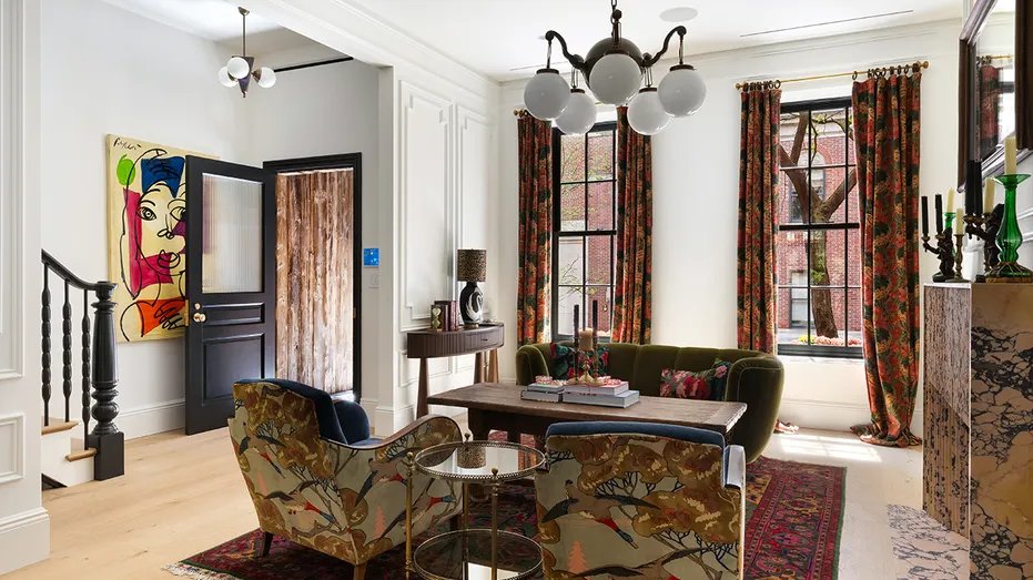 The home's living room features a fireplace and views of the street.