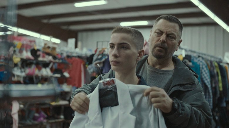 Nick Offerman's Jerry Kane holds a shirt over Jacob Tremblay's Joe Kane in Sovereign