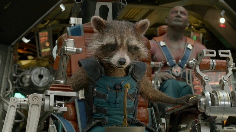Rocket Raccoon sits at the command of a ship in Guardians of the Galaxy