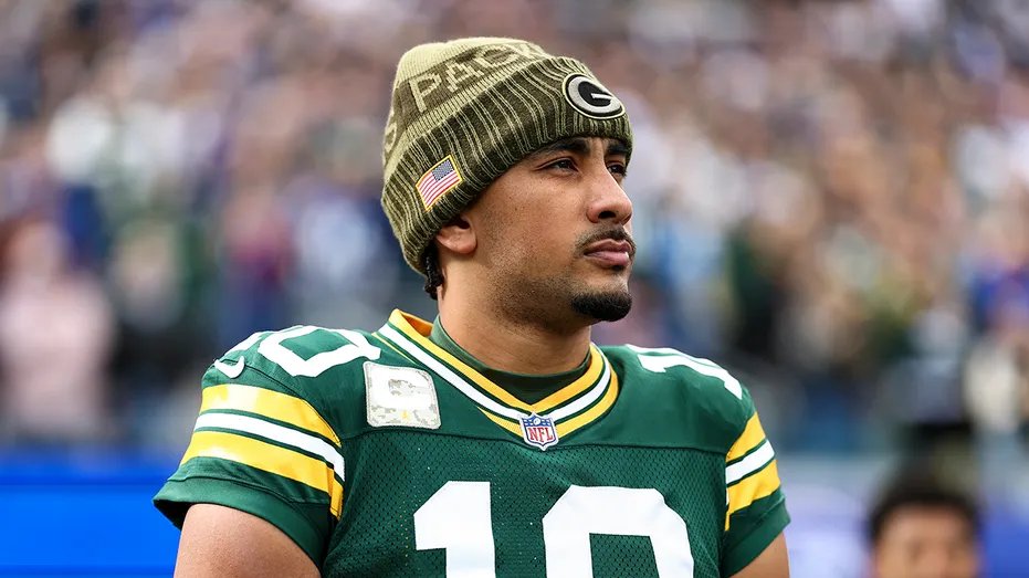 Jordan Love looks on the field