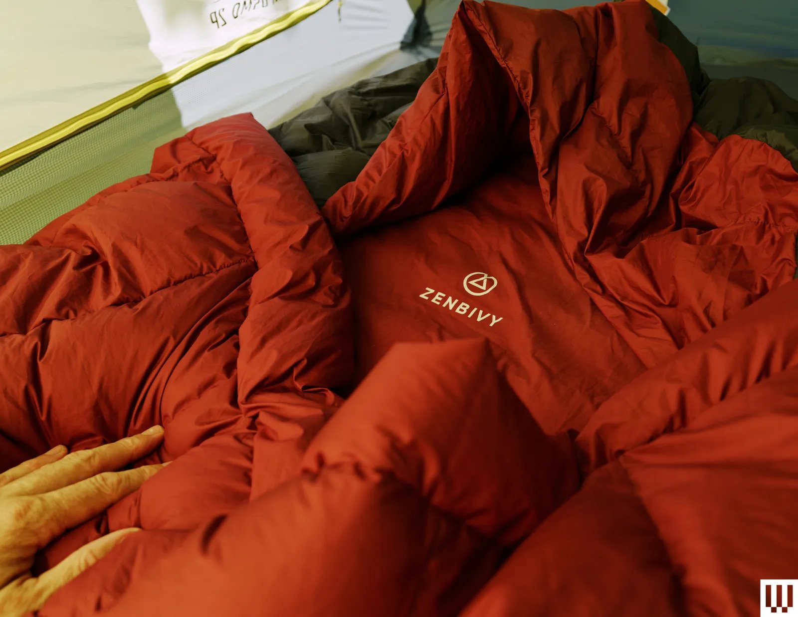 Image may contain Clothing Coat Jacket Blanket Bed Furniture Baby and Person