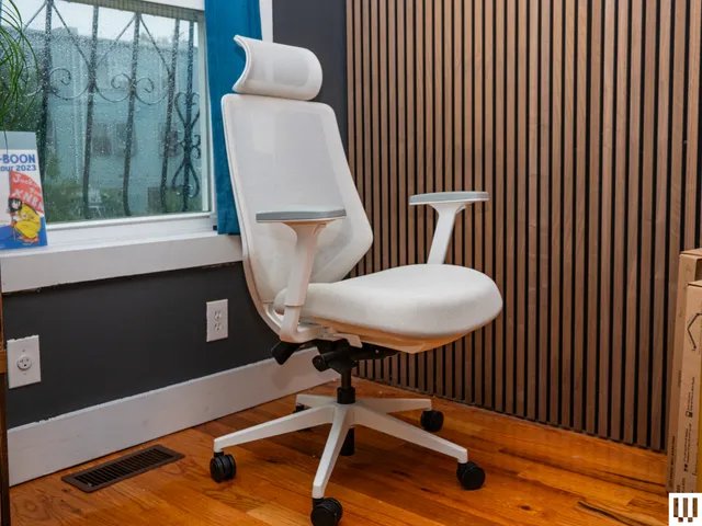 Image may contain: Indoors, Interior Design, Chair, Furniture, Wood Panels, Wood, Office, and Office Chair