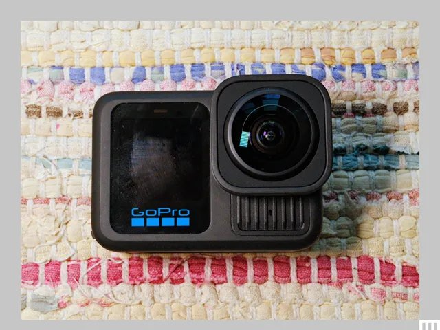 GoPro Hero 13 Black is a small camera with a digital screen on the left and a square lens on the right