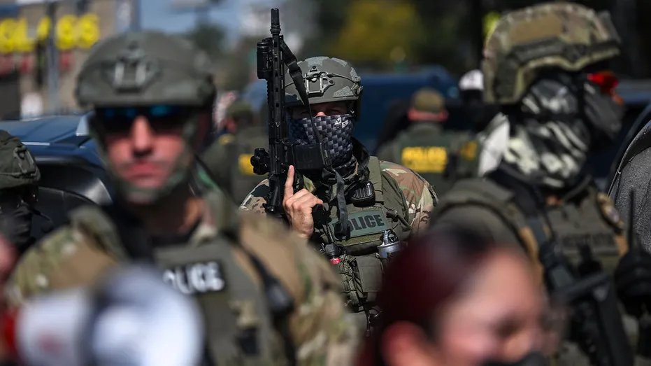 Federal officers prepared to march through the streets