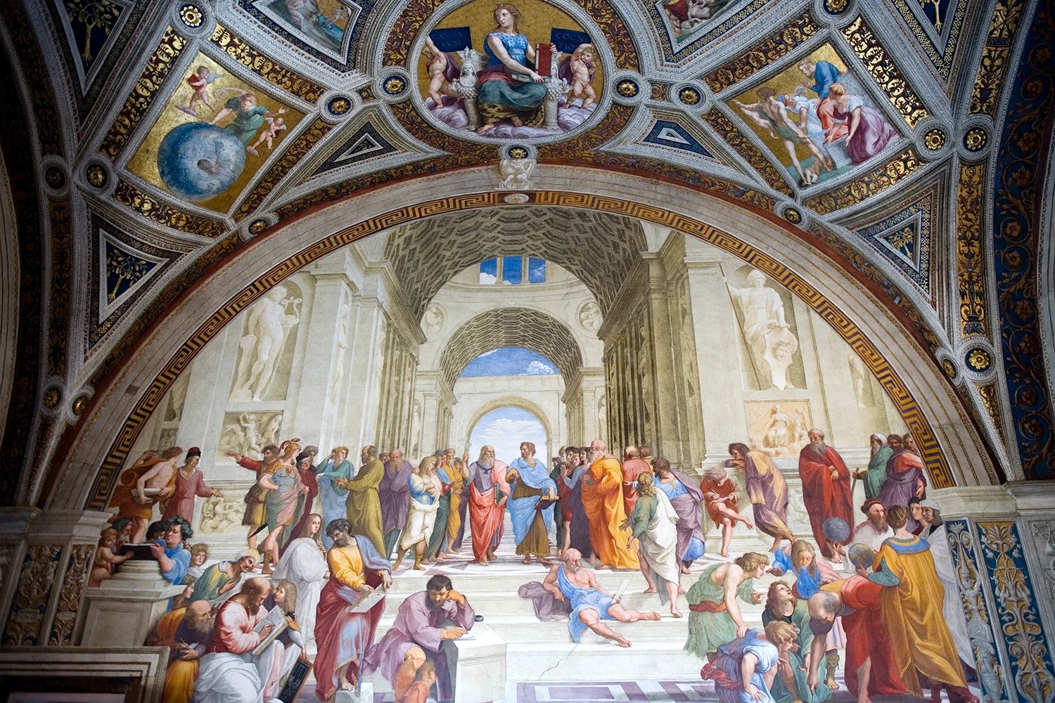 A Renaissance fresco showing ancient Greek philosophers gathered in a grand architectural hall, with Plato and Aristotle walking at the center.