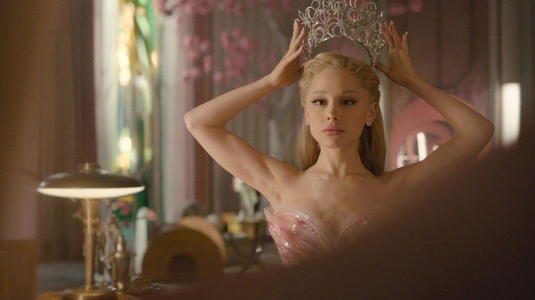 Glinda wears her tiara in the mirror in Wicked: For Good