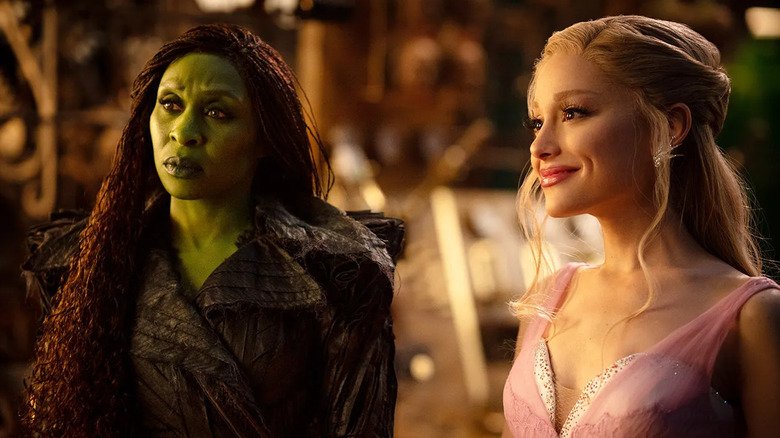 Elphaba looks confused and Glinda smiles at the wizard in Wicked: For Good