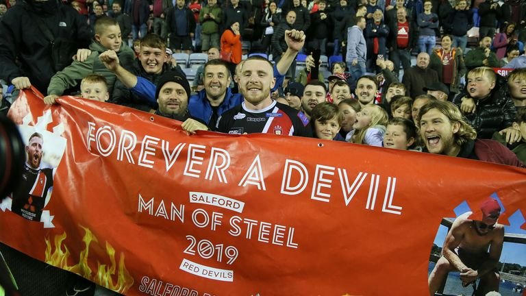 Salford Reds' Jackson Hastings celebrates with fans after beating Wigan to reach the Betfred Premier League final