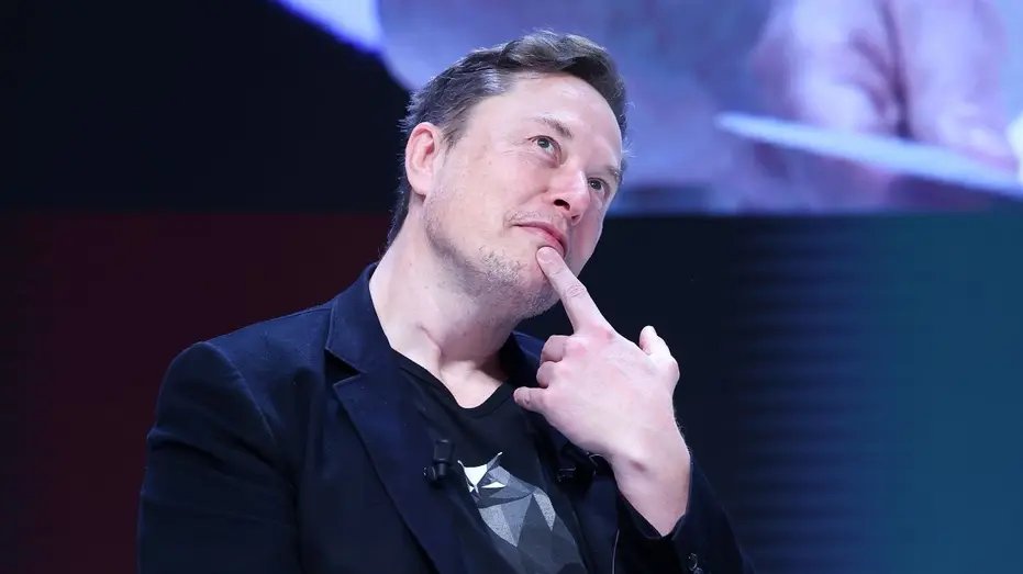 Elon Musk takes a thoughtful break with his finger on his chin