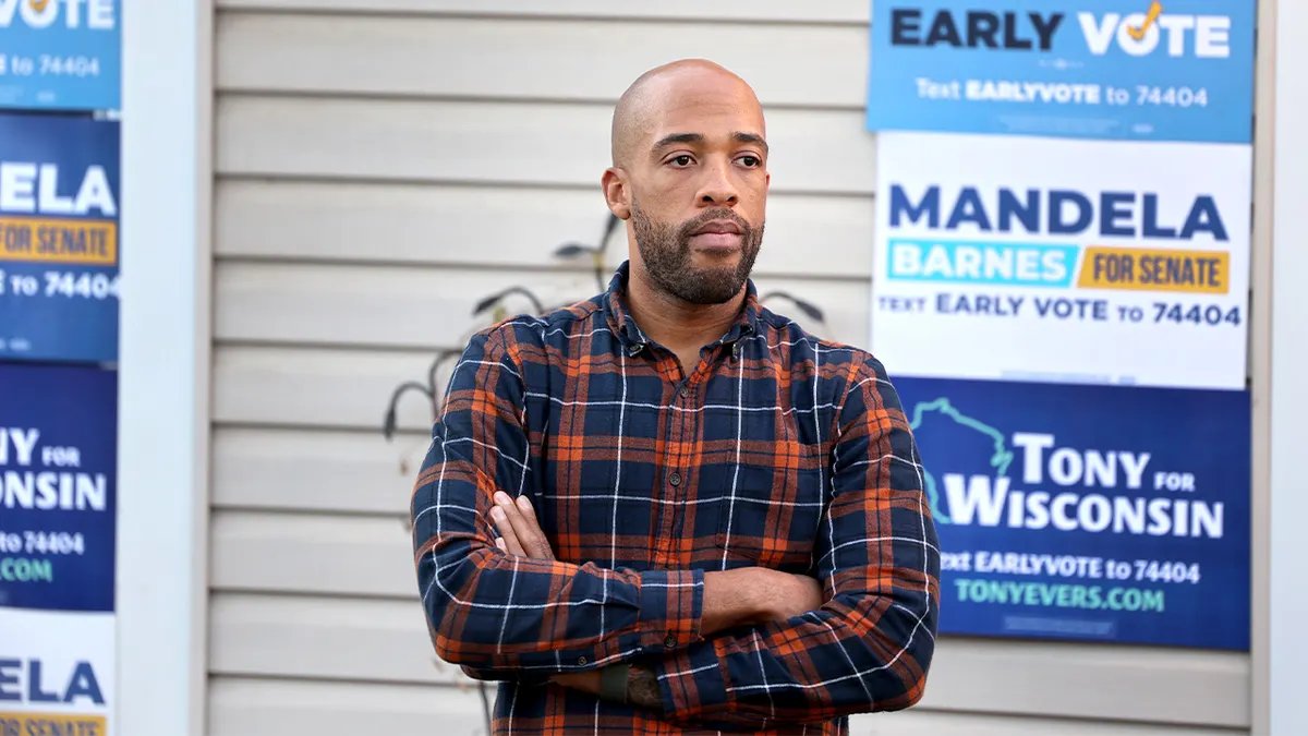 Mandela Barnes stands among his supporters at a campaign rally in Madison.