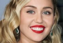 1764688475 Miley Cyrus Bold Red Carpet Look Comes With A Mystery.jpg