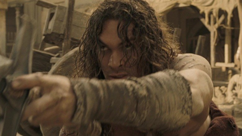 Jason Momoa as Conan struggles to stand on his feet in Conan the Barbarian (2011)