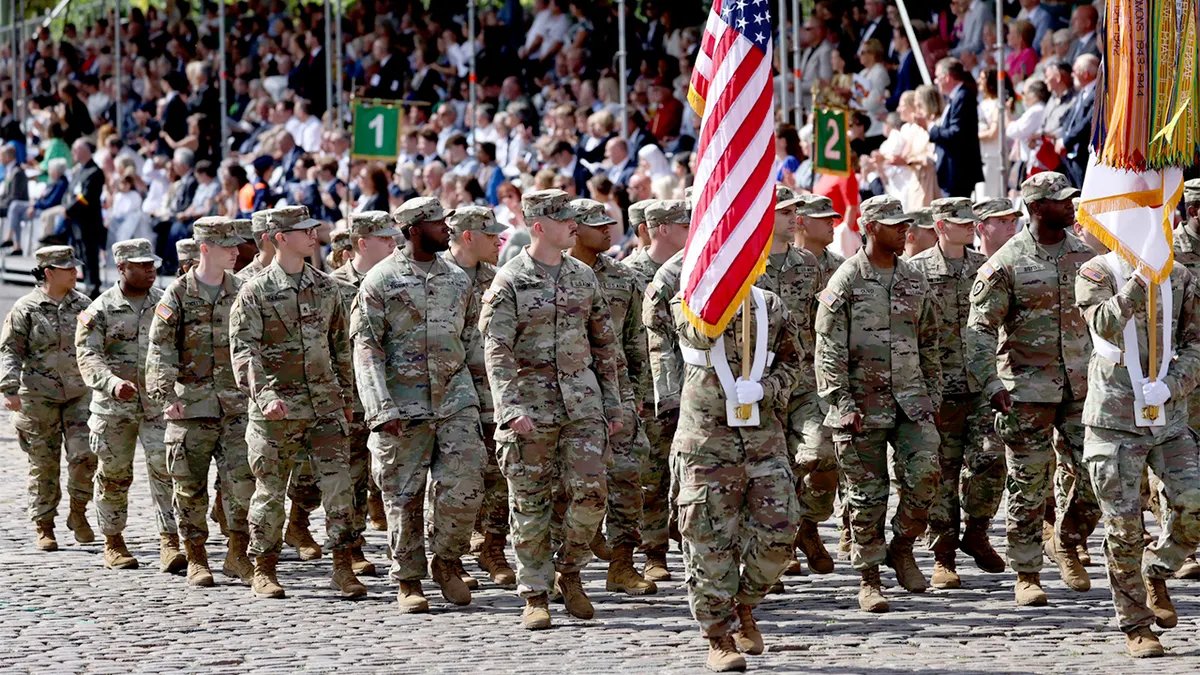 US Army soldiers march in formation during Belgium's National Day Parade in Brussels.