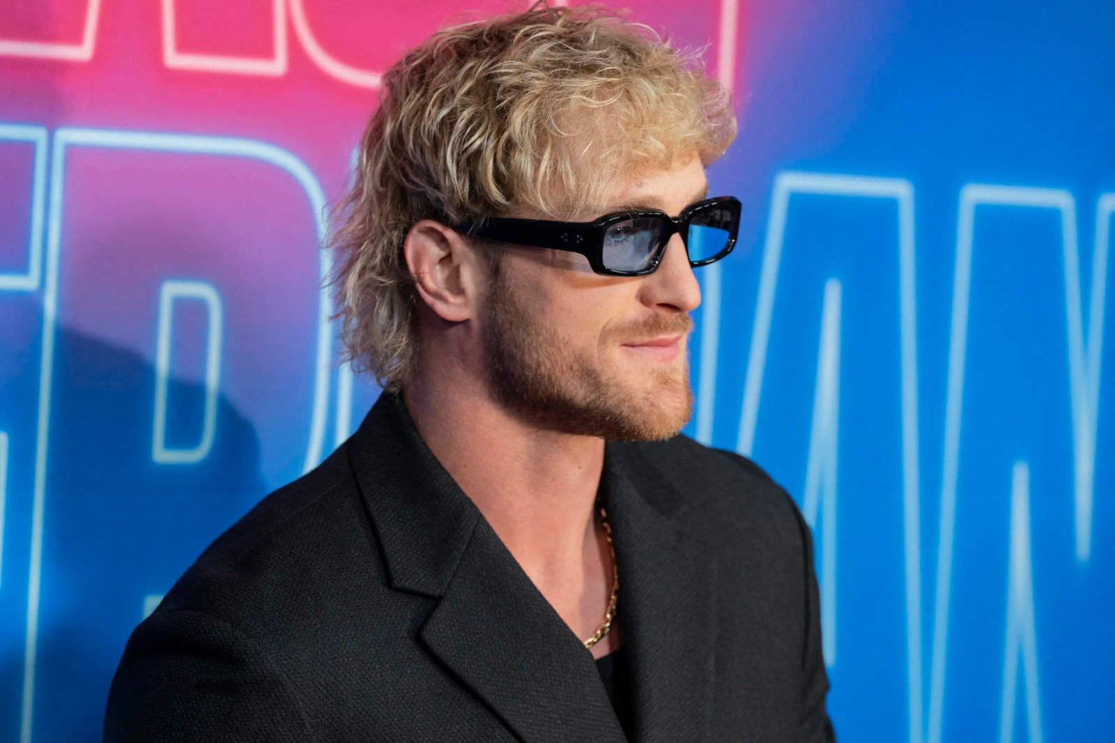Logan Paul poses on the red carpet. 