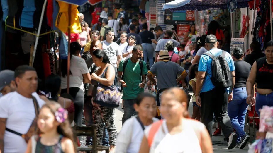 People walking in a neighborhood in Caracas, Venezuela.