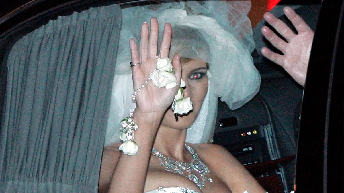 Melania Trump is seen waving as she leaves Bethesda-by-the-Sea Episcopal Church after her wedding on January 22, 2005.