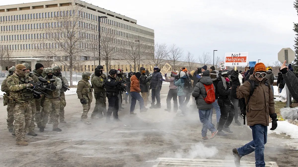Federal officers fire pepper balls at a group of demonstrators during a protest in Minneapolis.