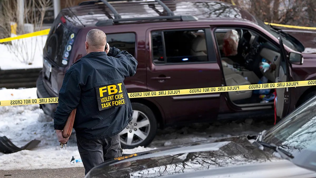 A car crashes at the scene where an ICE agent shot Renee Good.