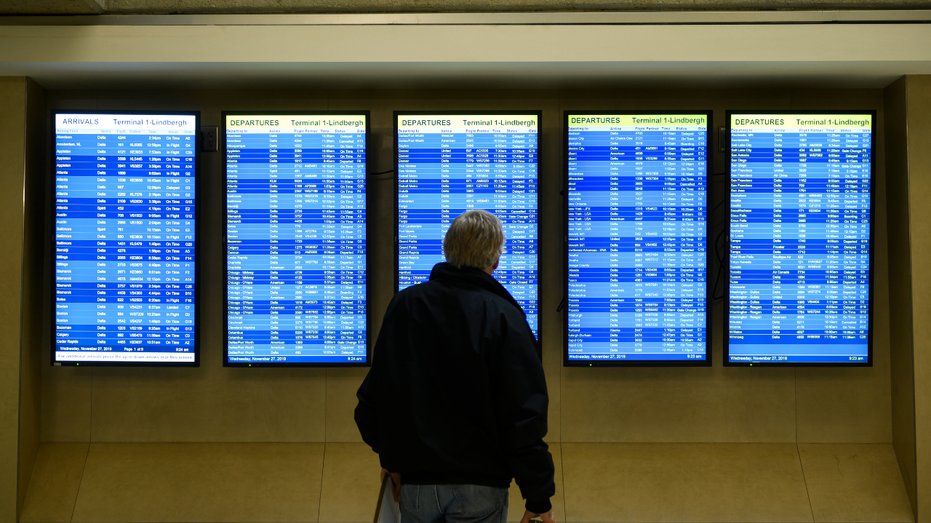 A man checks the status of flights