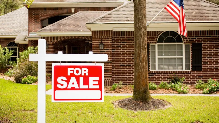 Home with A "For sale" Banner