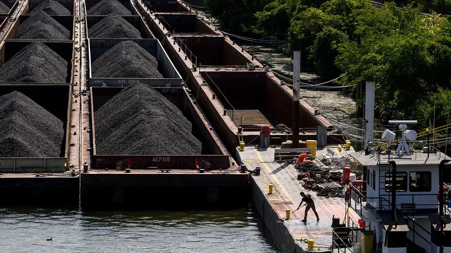 Coal on barges in Pittsburgh, U.S., Monday, September 9, 2024. Weekly U.S. coal production fell 13.8% year-to-date for the week ending August 31 according to the Department of Energy. Photographer: Justin Merriman/Bloomberg via Getty Images
