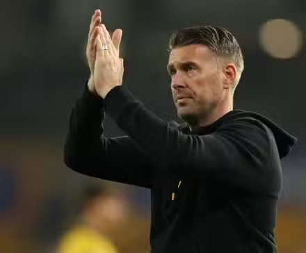 Wolverhampton Wanderers manager, Rob Edwards, applauds fans after the match