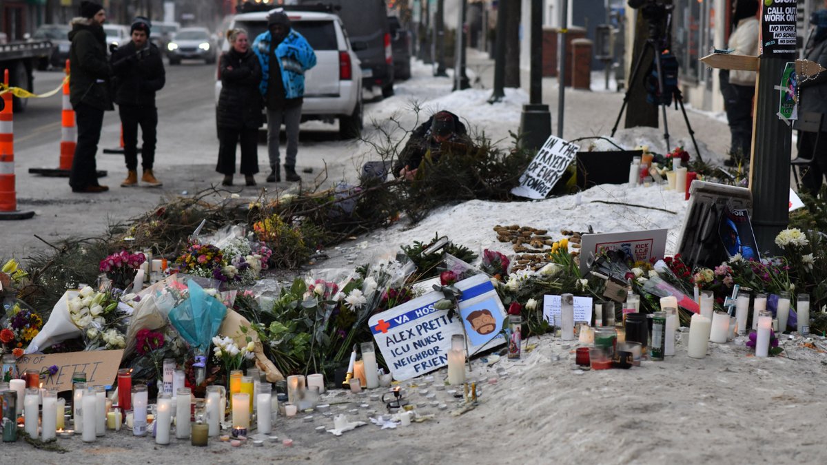 Flowers and candles appear at the scene of Alex Peretti's death in Minneapolis, Minnesota, on January 25, 2026.